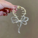 Hårspenne med sløyfe